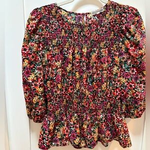 This floral top is a Pleione Anthropologie 3/4 puff-sleeve blouse. Size M